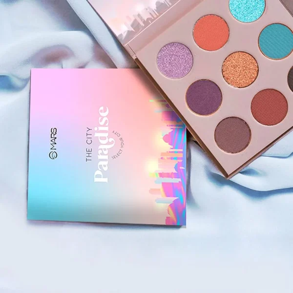 New makeup palette displayed on a vibrant blue background, showcasing its colors and design.