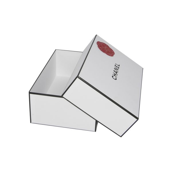 A white box featuring a prominent red heart design on its surface.