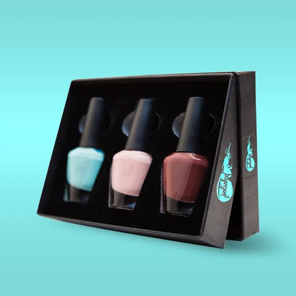 A black box containing a set of nail polish bottles, elegantly arranged for display.