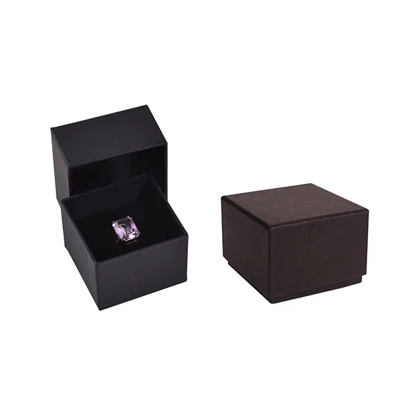 A black box containing a purple ring inside, showcasing a simple yet striking geometric design.